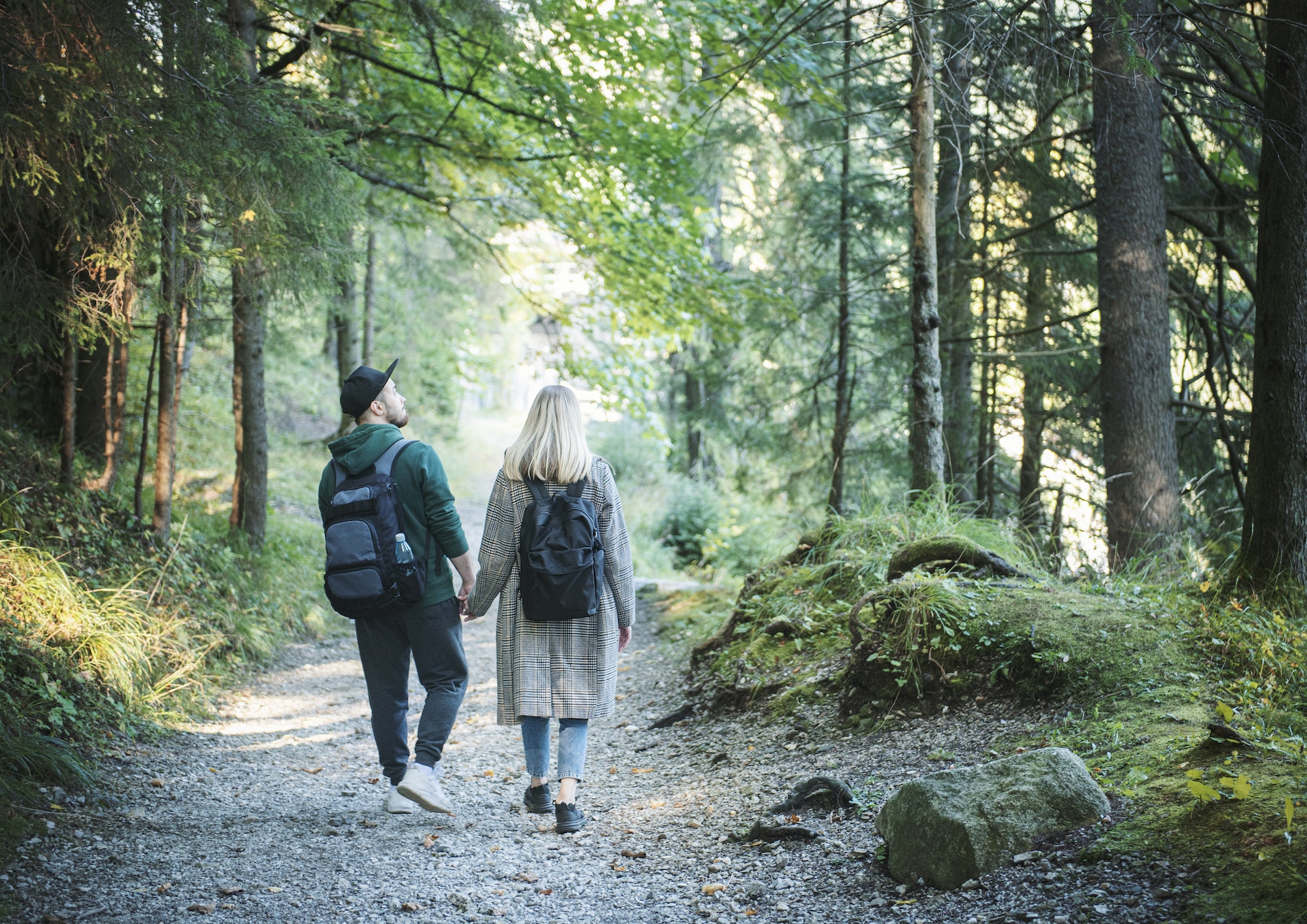 Traveler couple in love enjoying in the forest. Freedom and active lifestyle concept.